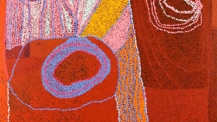 A painting with orange and red abstract shapes